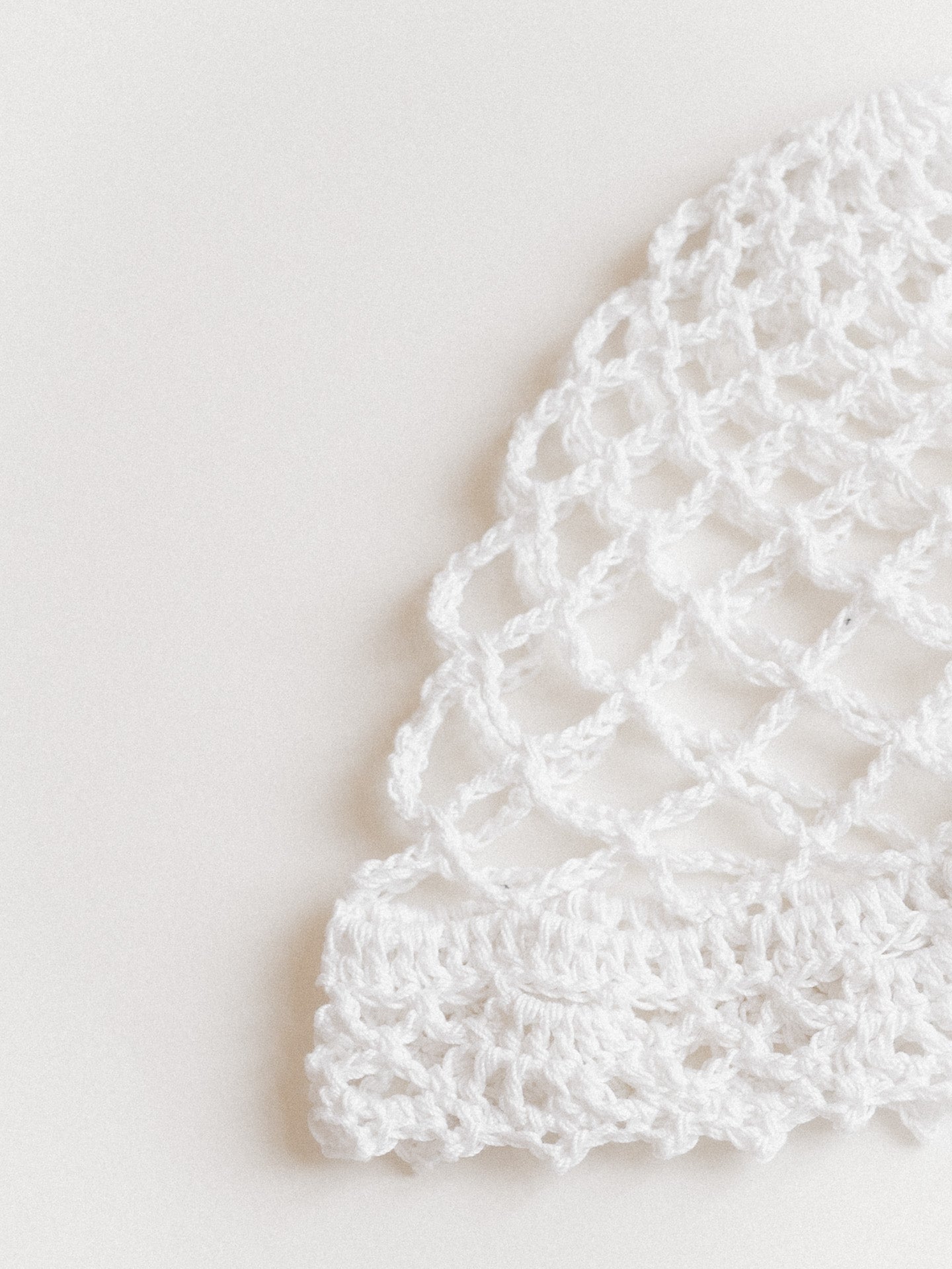 Lightweight lace-knit beanie